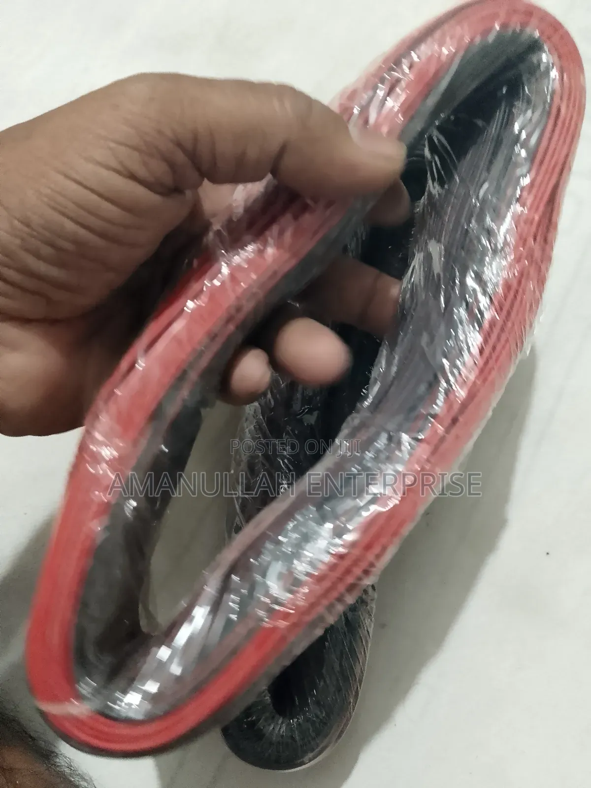 Coil of Red and Black PVC Insulated Flexible Electric Cable.