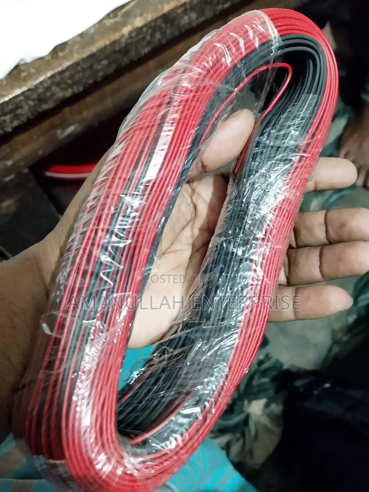 Coil of Red and Black PVC Insulated Flexible Electric Cable.