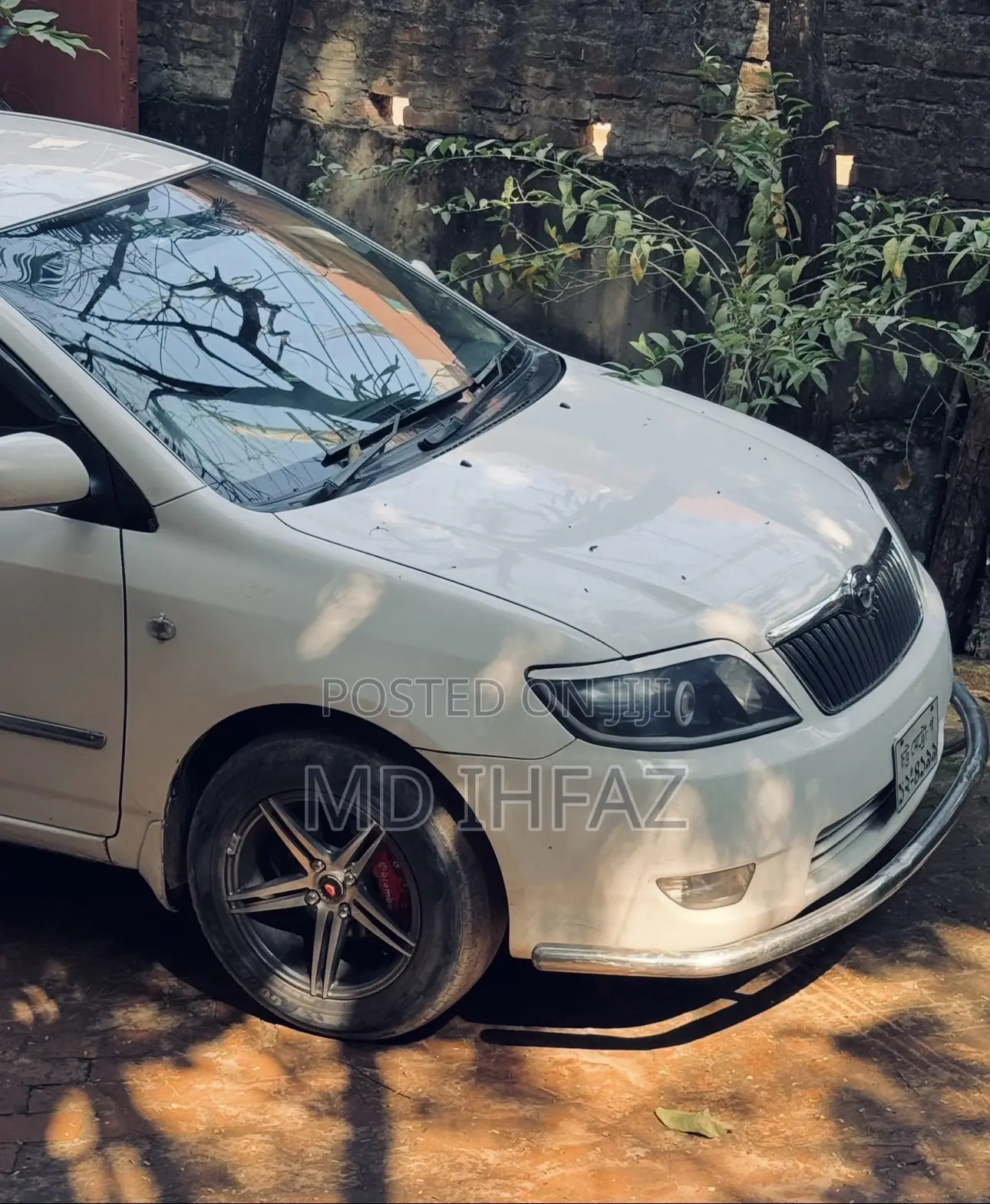 টয়োটা করোলা ২০০৪ সাদা