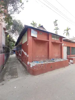 Three decimals of land with a house for sale by the roadside