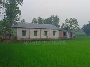 Land with house for sale.