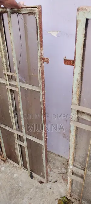 পুরাতন দুইটি লোহার জানালা ।