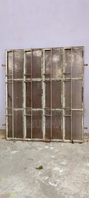 পুরাতন দুইটি লোহার জানালা ।
