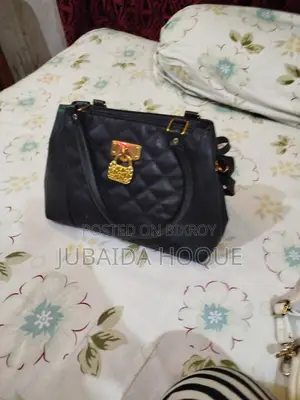 Stylish Quilted Black Handbag with Golden Lock Detail