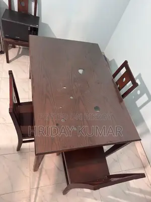 Stylish 6-Seater Dining Table and 4 Chairs for Sale (Almost New)