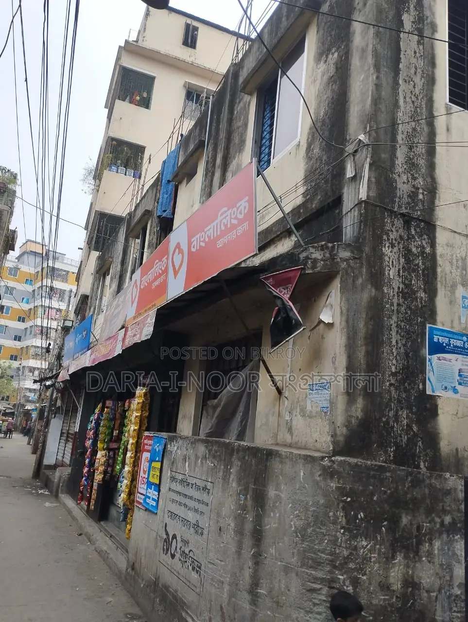 Two-story house with shops for sale in Khilgaon, offering an income opportunity of over 1 lakh