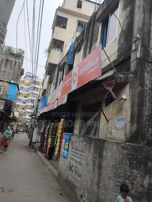 Two-story house with shops for sale in Khilgaon, offering an income opportunity of over 1 lakh