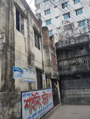 Two-story house with shops for sale in Khilgaon, offering an income opportunity of over 1 lakh