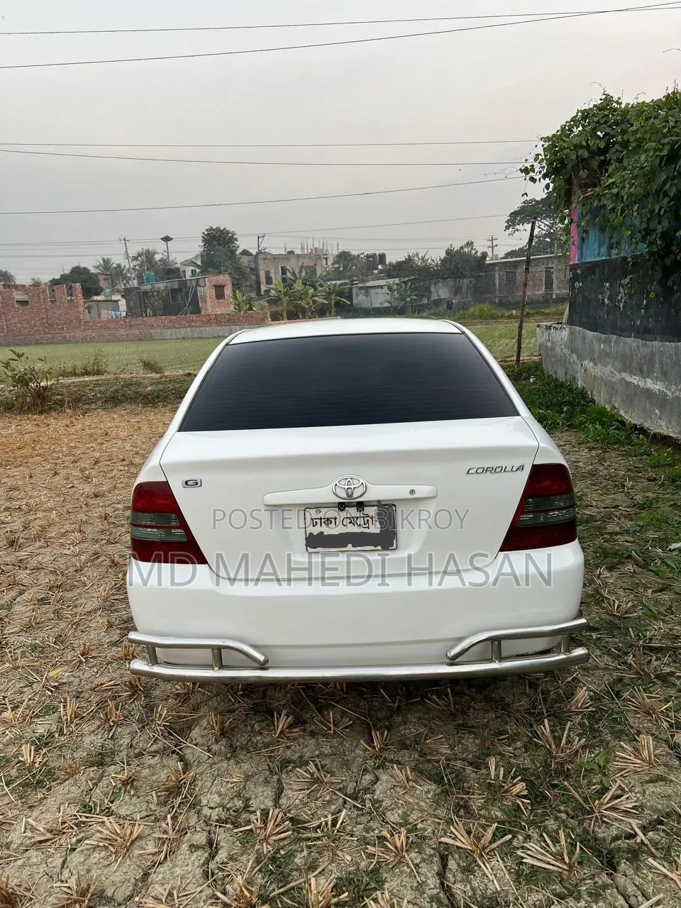 টয়োটা করোলা ২০০২ সাদা