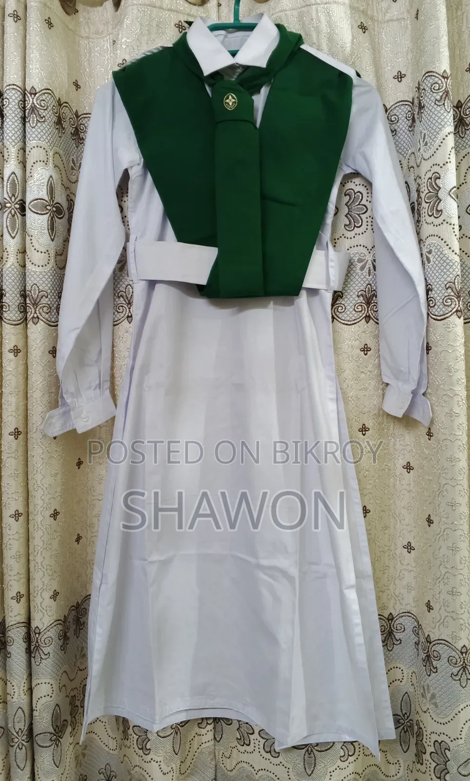 Intact Girl Guide dress with membership badge for sale.