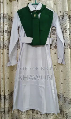 Intact Girl Guide dress with membership badge for sale.