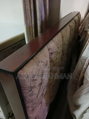 কাঠের বিছানা