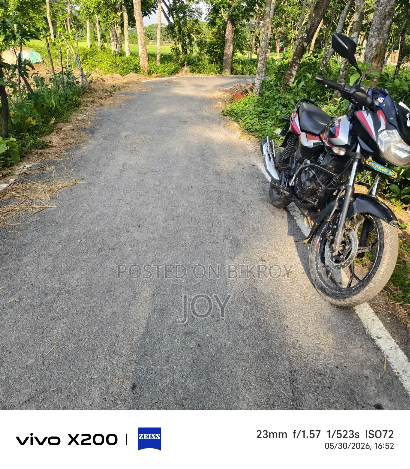 5 decimal land for sale next to a pitch-paved road
