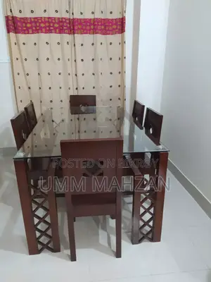 This Canadian and Mahogany wood dining table is for sale.