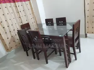 This Canadian and Mahogany wood dining table is for sale.
