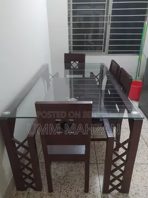 This Canadian and Mahogany wood dining table is for sale.