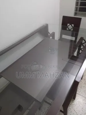 This Canadian and Mahogany wood dining table is for sale.