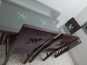 This Canadian and Mahogany wood dining table is for sale.