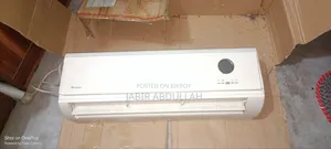 AC is running, includes indoor unit, outdoor unit, display, remote, and pipes