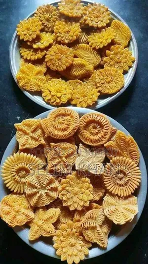 Nakshi Pitha and Jhinuk Pitha soaked in molasses syrup
