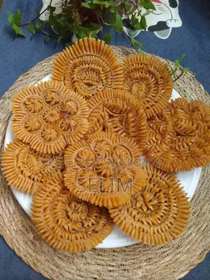 Nakshi Pitha is not just food, it is a piece of rural art carved on pitha