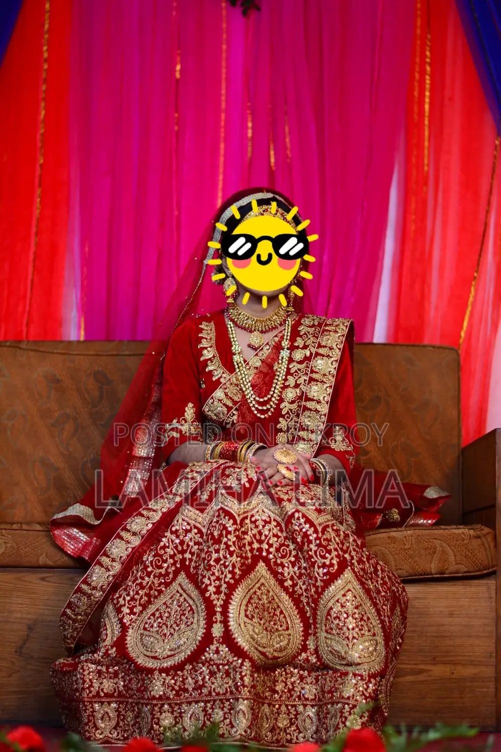 Wedding Lehenga. Deep red or maroon color.