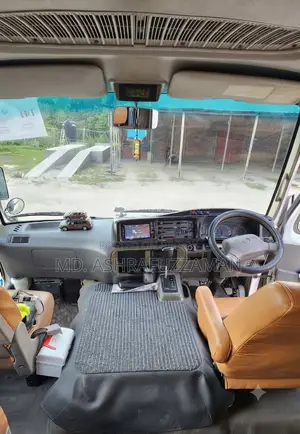 টয়োটা কোস্টার ২০১৫ বেইজ