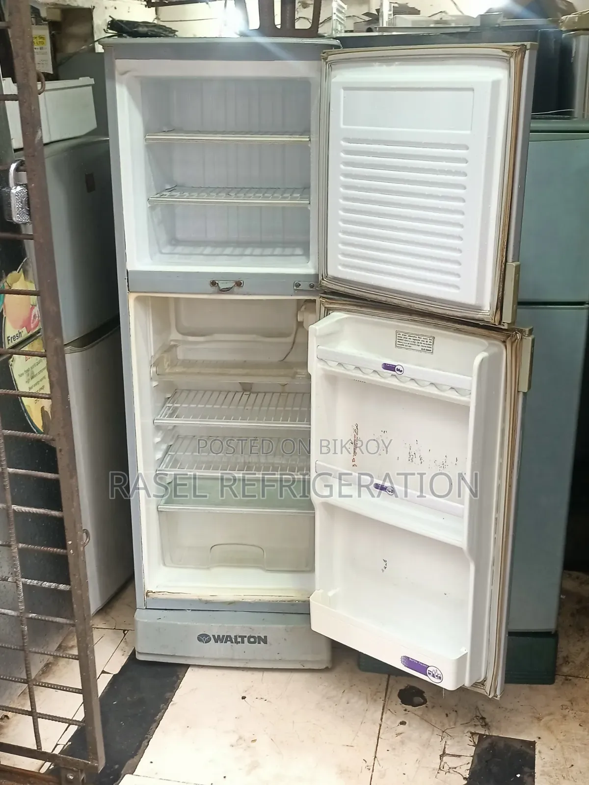 Red 14 Cubic Feet Walton Refrigerator for sale.