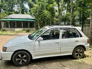 টয়োটা স্টারলেট গ্লানজা ১৯৯৫ সাদা