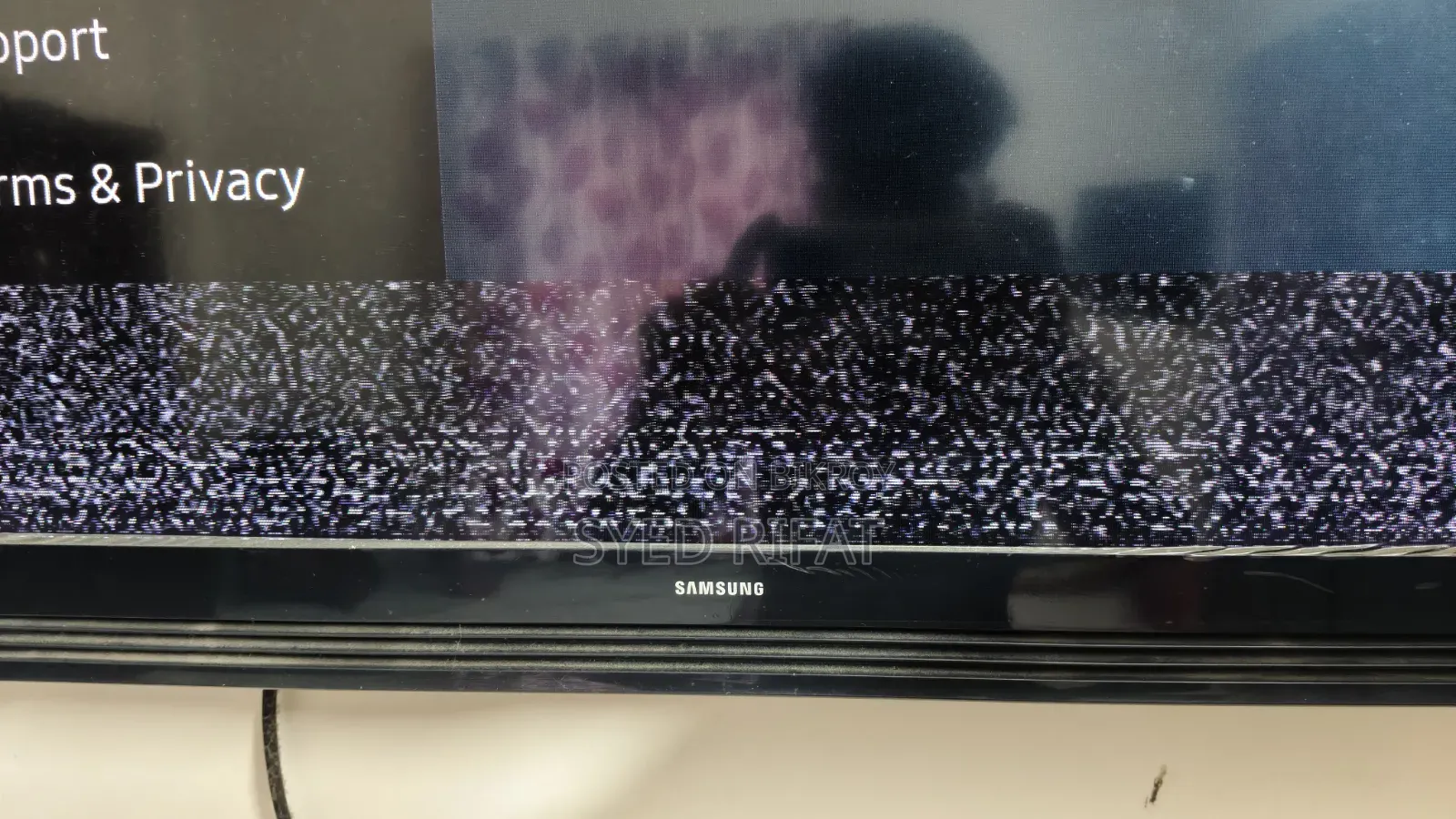 This Is A Samsung Smart Tv Featuring A Black Bezel Wall-mounted Setup
