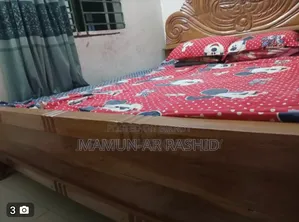 Sale of a Mahogany Wooden Bed