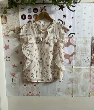 beige ruffled blouse