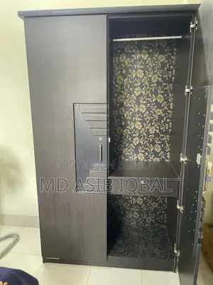 Two-door wardrobe made of Malaysian board for sale.