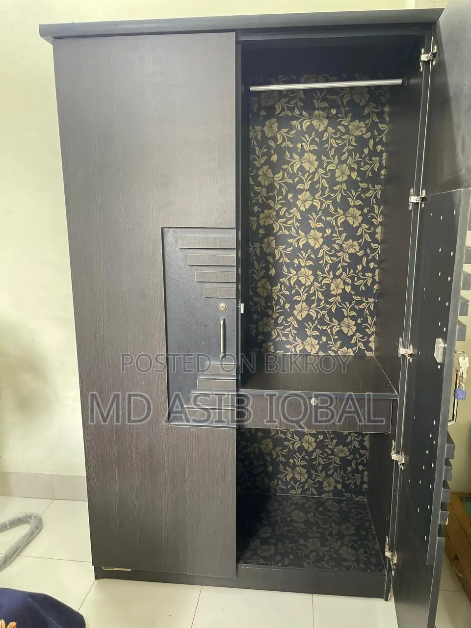 Two-door wardrobe made of Malaysian board for sale.