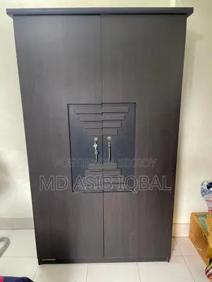 Two-door wardrobe made of Malaysian board for sale.