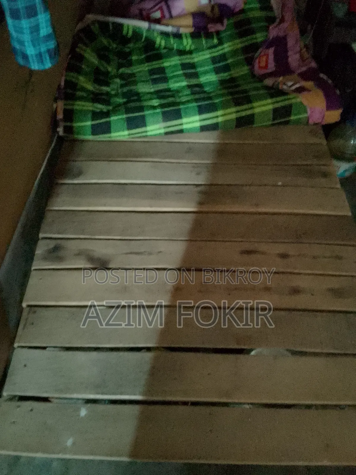 A single wooden bed frame and a single mattress will be sold in Basabo Nandipara