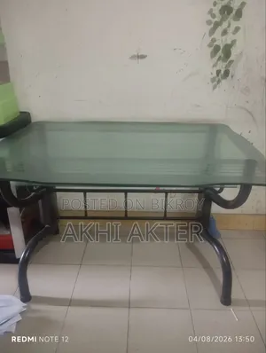 Dining table for sale with 4 chairs, including 3 matching chairs.