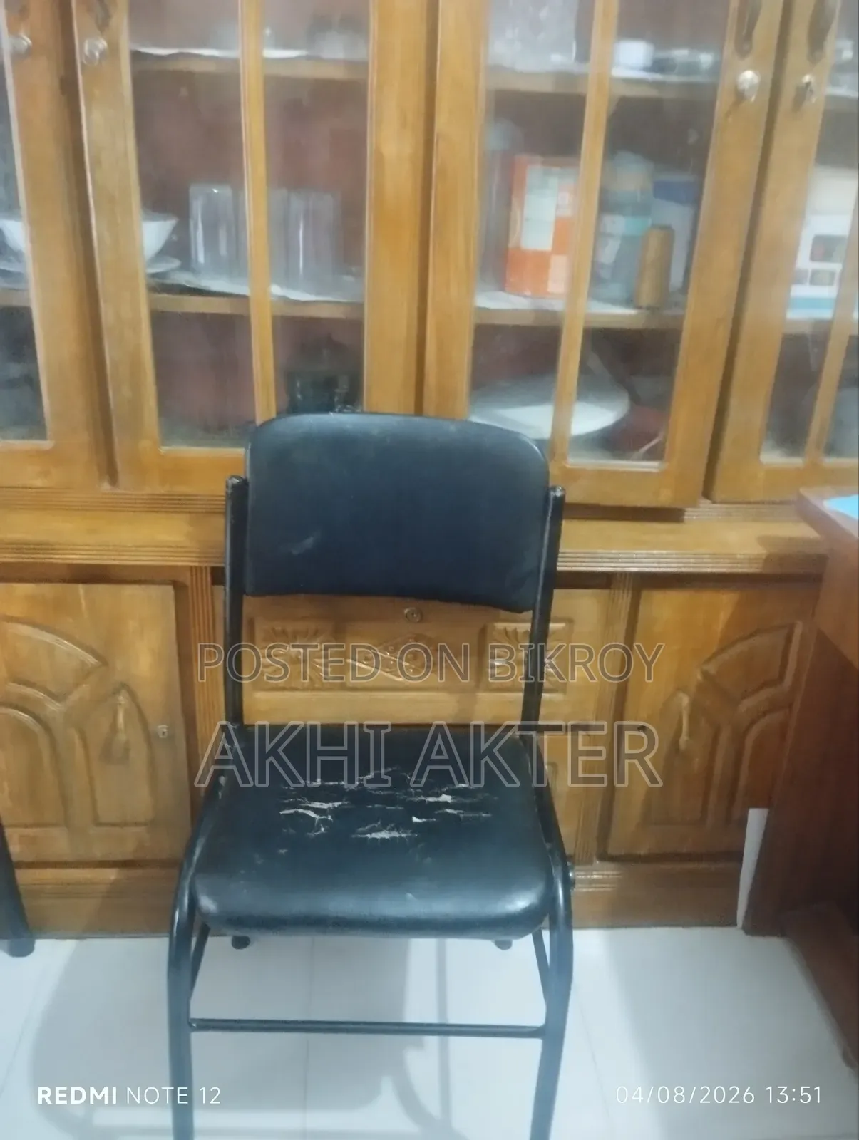 Dining table for sale with 4 chairs, including 3 matching chairs.