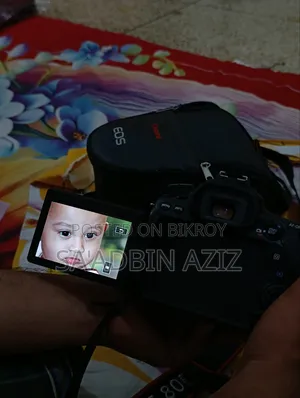 ক্যানন ইওএস ৮০ডি ডিএসএলআর ক্যামেরা+ক্যানন ৫০মিমি এফ/১.৮ এসটিএম+ব্যাটারি+চার্জার+৩২জিবি এসডি