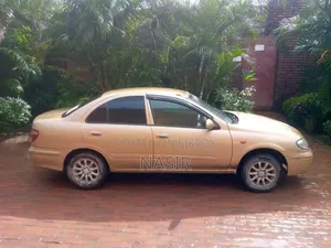 2025 Gold Nissan Sunny