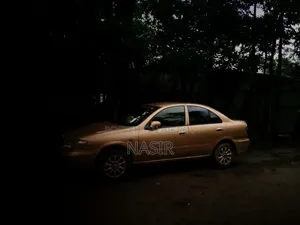 2025 Gold Nissan Sunny