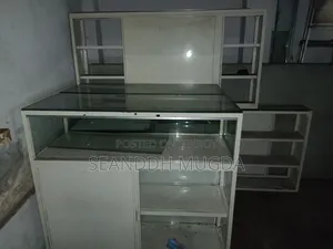 Showcase for mobile or eyewear shop, equipped with steel and glass lights.