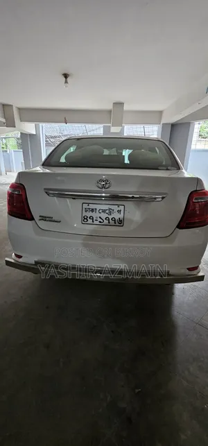 টয়োটা অ্যাক্সিও ২০১৬ সাদা